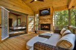 Come relax by the wood burning fireplace on main level deck 